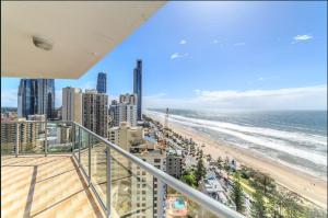 a balcony with a view of the beach and buildings at Endless ocean views, spacious, resort facilities in Gold Coast