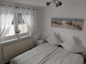 Llit o llits en una habitació de Ferienwohnung Finja