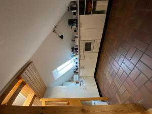 a staircase in the attic of a house at Harmonie in Prerow +7 photos