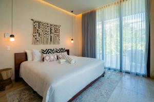 Postel nebo postele na pokoji v ubytování Bloom Tulum Apartments