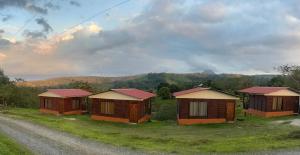 a group of cottages on the side of a road at Cabañas venado 2 in Venado