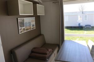 Χώρος καθιστικού στο Mobilheim Herzmuschel mit Veranda am Kransburger See 554