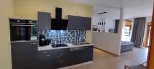 a kitchen with a sink and a counter top at Fichtennest in Bingerbrück