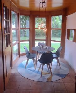 a dining room with a table and chairs at Fichtennest in Bingerbrück +11 photos
