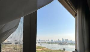 a view of a river from a window at شقة فندقية علي النيل للعائلات بالقاهرة in Cairo
