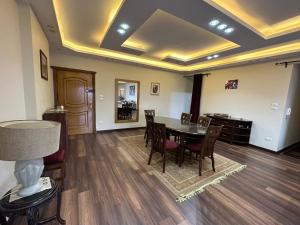 a dining room with a table and chairs at شقة فندقية علي النيل للعائلات بالقاهرة in Cairo +5 photos