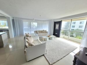 a living room with a couch and a rug at Surfers Chalet in Gold Coast