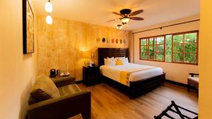 Ένα ή περισσότερα κρεβάτια σε δωμάτιο στο Buena Vista Chic Hotel