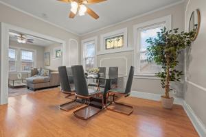 a dining room with a table and chairs at 2-Story Stay with Game Lounge & Free Parking Spots - 5 mins to NYC Train in Linden