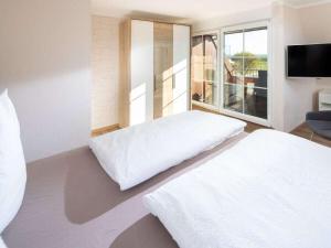 Postel nebo postele na pokoji v ubytování Seemannsgarn Comfortable holiday residence