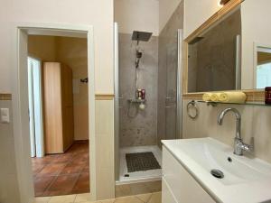 a bathroom with a sink and a shower at Palais am Park - App Luxembourg - Corner apartment No 1 in Kühlungsborn +27 photos
