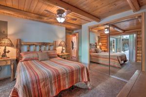 a bedroom with two beds and a ceiling fan at Cascade Cabin with Mountain View and River Access in Cascade