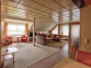 a living room with a couch and a table at Holiday apartment F995 at Wulfener Hals, Fehmarn in Wulfen auf Fehmarn