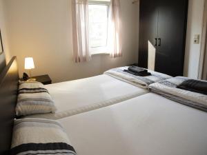 Postel nebo postele na pokoji v ubytování Summer freshness Comfortable holiday residence