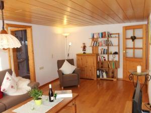 a living room with a couch and a table at on the Willmann farm in Erlenbach +31 photos