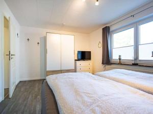 Voodi või voodid majutusasutuse Old Merchant on the Baltic Sea Beach toas