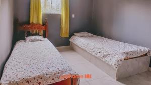 En eller flere senge i et værelse på Casa em Ilheus com Piscina Próxima a Praia