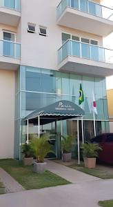 an office building with an awning in front of it at flat Joao in Lagoa Santa