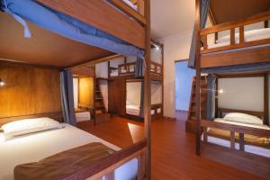 Ένα ή περισσότερα κρεβάτια σε δωμάτιο στο Simpang Inn Hostel