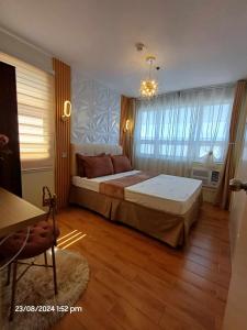 Katil atau katil-katil dalam bilik di Comfy & Cozy Staycation Davao
