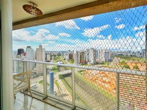 a balcony with a view of a city at Lindo Apartamento dentro do Shopping in Águas Claras