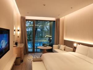 TV a/nebo společenská místnost v ubytování C&D Hotel Dongshan Zhangzhou