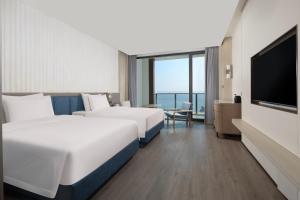 Postel nebo postele na pokoji v ubytování C&D Hotel Dongshan Zhangzhou