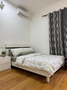 a bedroom with two beds and a curtain at Sea View in Meedhoo