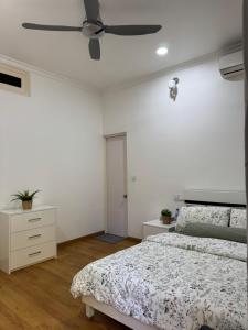 a bedroom with a bed and a ceiling fan at Sea View in Meedhoo