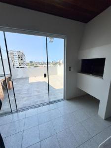 Μια τηλεόραση ή/και κέντρο ψυχαγωγίας στο Duplex 3 quartos, centro, terraço e churrasqueira
