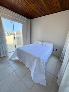 Ένα ή περισσότερα κρεβάτια σε δωμάτιο στο Duplex 3 quartos, centro, terraço e churrasqueira
