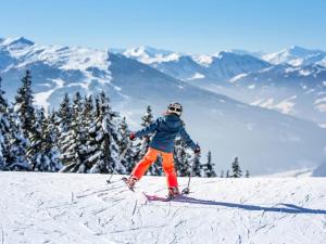 a person is skiing down a snow covered mountain at Apartment Bär Comfortable holiday residence in Eben im Pongau