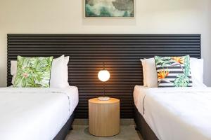 Postel nebo postele na pokoji v ubytování Zenhouse Harmony 4BR Modern Home Near CDU and Hospital + 42 fotografií