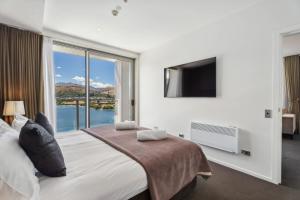 Ένα ή περισσότερα κρεβάτια σε δωμάτιο στο Five Star Luxury Kawarau Penthouse