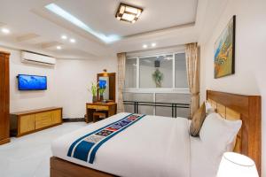 Postel nebo postele na pokoji v ubytování Sapa Paradise Hotel + 42 fotografií