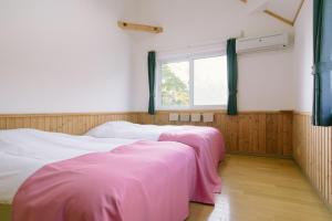 En eller flere senge i et værelse på Lodge Maroray