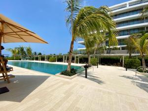 Bazén v ubytování Morros EOS Manzanillo piso 3 nebo v jeho okolí