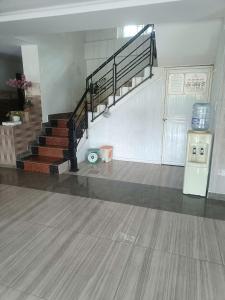a room with a gym with stairs and a trash can at Holiday Hotel in Phu Quoc