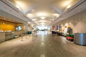 a hallway of a hospital with a waiting room at Toshi Center Hotel in Tokyo