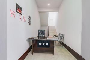 a room with a desk and a chair in it at SPOT ON Hotel chitransh inn in Lucknow