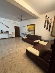 a living room with a couch and a table at Hostel Madras in Chennai