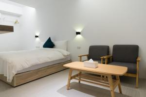 Postel nebo postele na pokoji v ubytování 森浩文旅