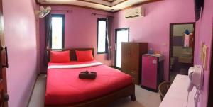Letto o letti in una camera di Baan Mulan