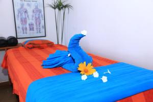 Postel nebo postele na pokoji v ubytování Topaz Beach Hotel