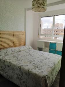 Postel nebo postele na pokoji v ubytování Isla cristina, playa central