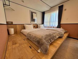 Postel nebo postele na pokoji v ubytování One's Residence Sapporo