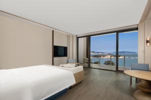 Postel nebo postele na pokoji v ubytování C&D Hotel Dongshan Zhangzhou
