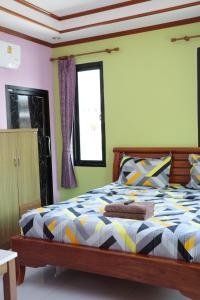 Letto o letti in una camera di Baan Mulan
