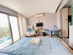 Katil atau katil-katil dalam bilik di Venetian Signature Pattaya +35 gambar