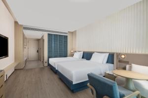 Postel nebo postele na pokoji v ubytování C&D Hotel Dongshan Zhangzhou